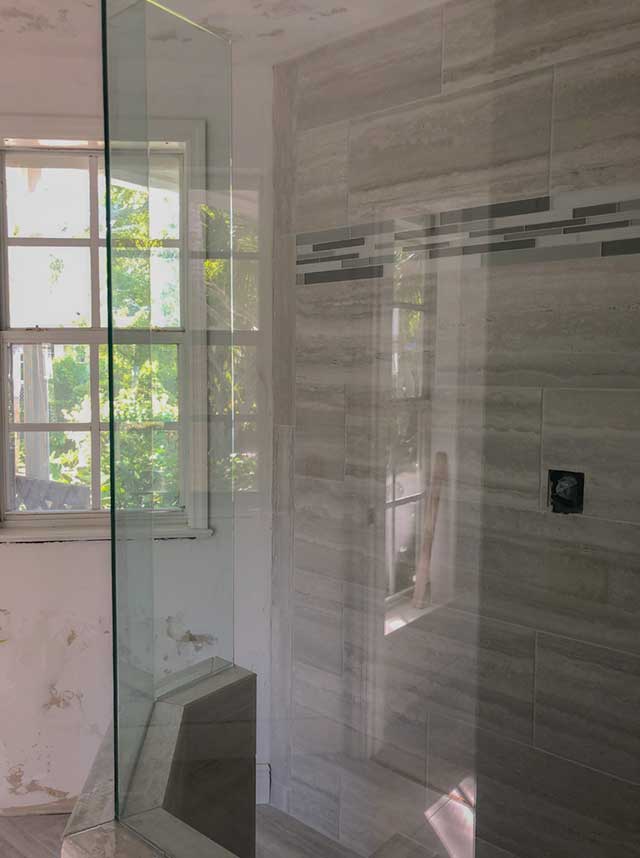 Custom glass shower door installation in Sarasota, FL.